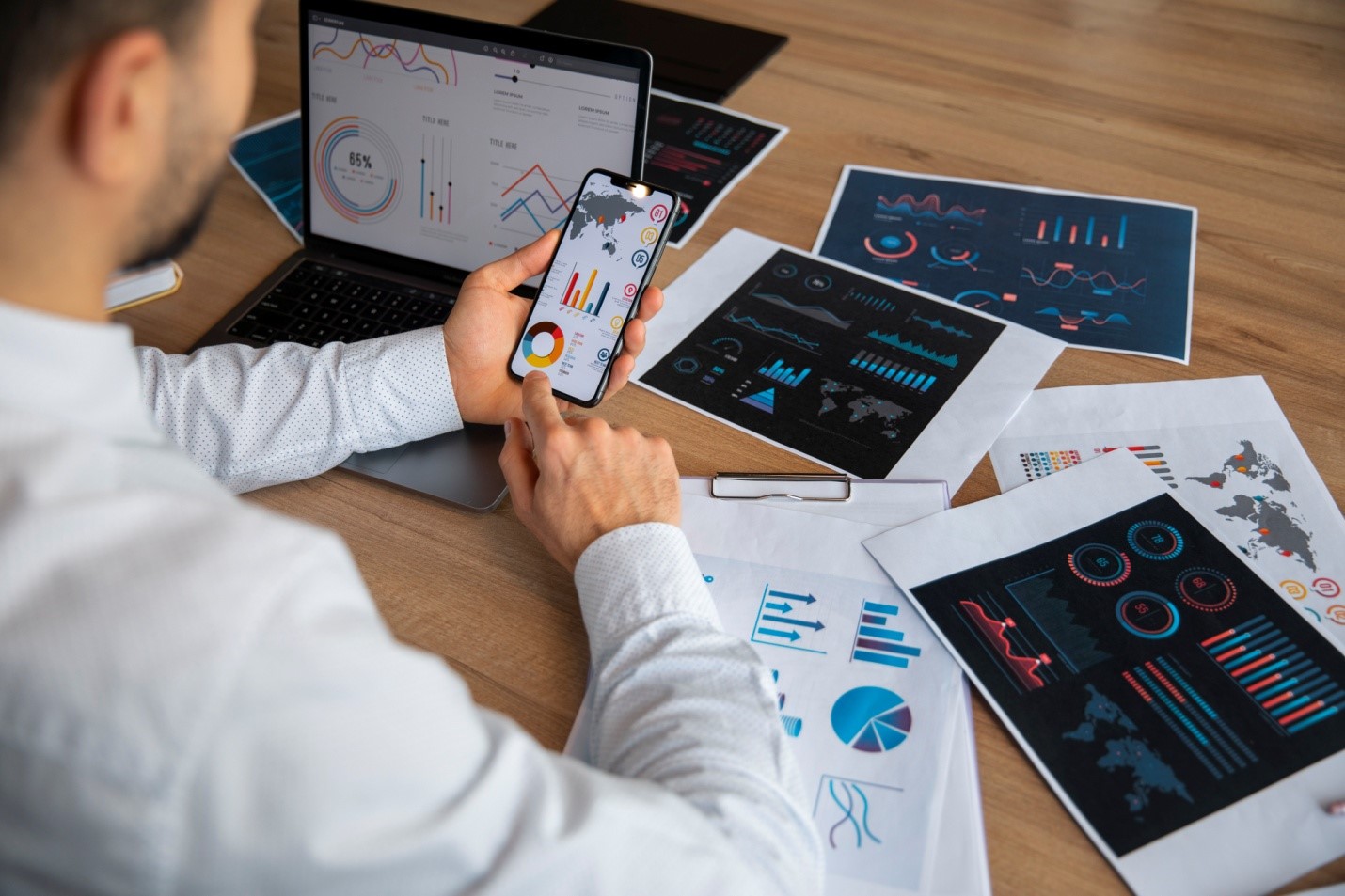 Featuring a team of office workers collaborating around a table, the scene emphasizes data-driven decision-making